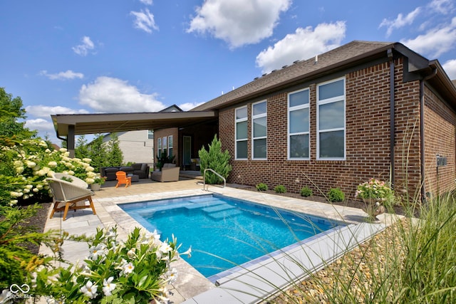 outdoor pool featuring a patio and an outdoor living space