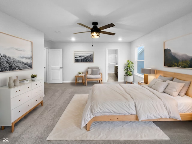 carpeted bedroom featuring ensuite bath, baseboards, a ceiling fan, and recessed lighting