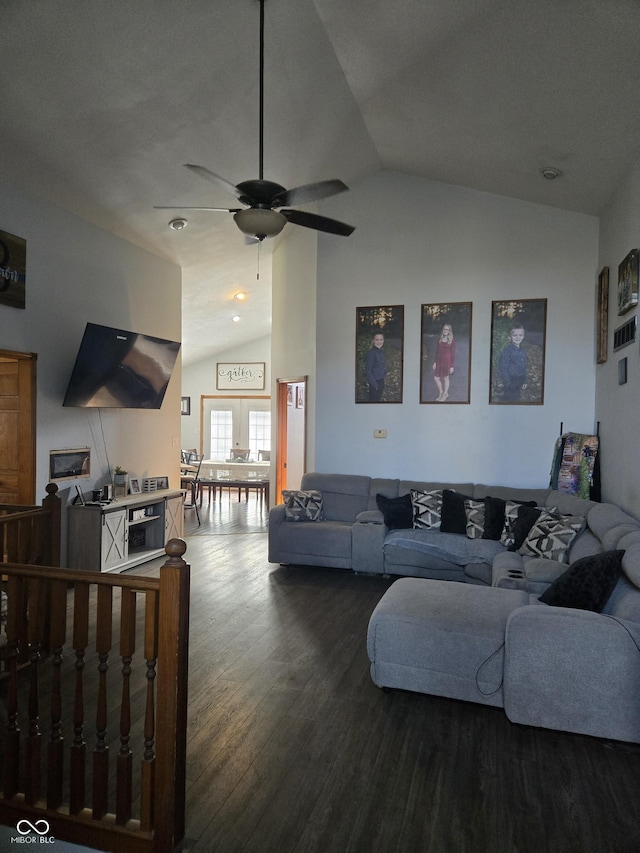 living area with ceiling fan, high vaulted ceiling, and wood finished floors