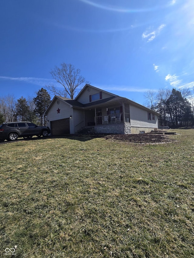 view of front facade with a garage and a front lawn