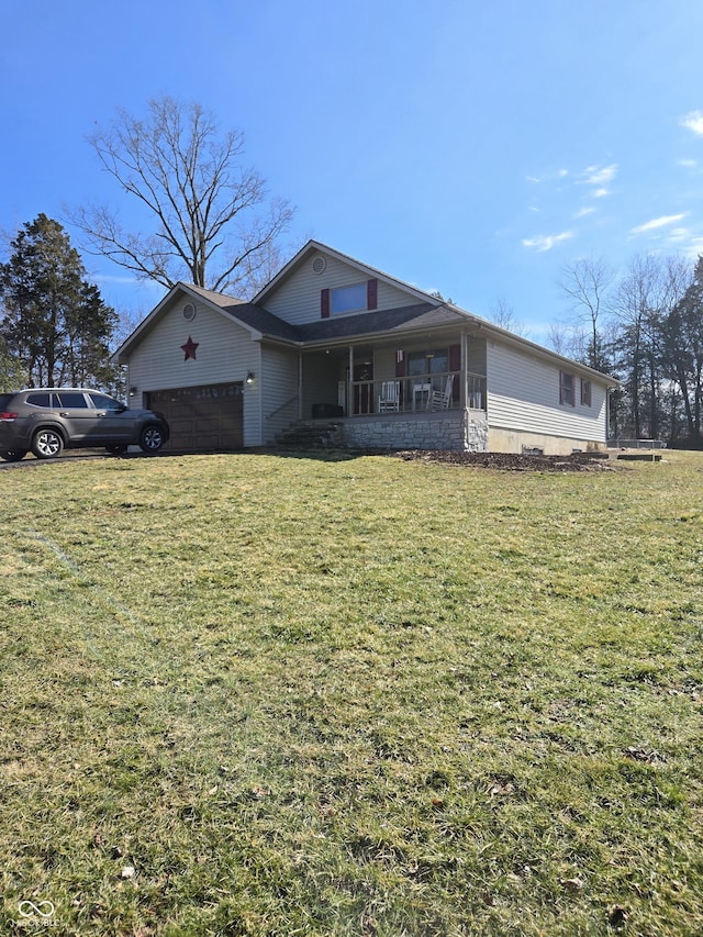 view of front of house featuring a porch, a front yard, and an attached garage