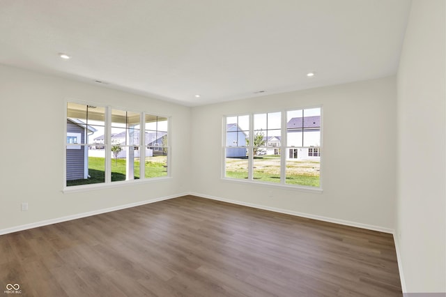 19714 Highclere Ln, Sheridan, IN 46069 - spare room featuring baseboards, recessed lighting, dark wood finished floors, and a wealth of natural light