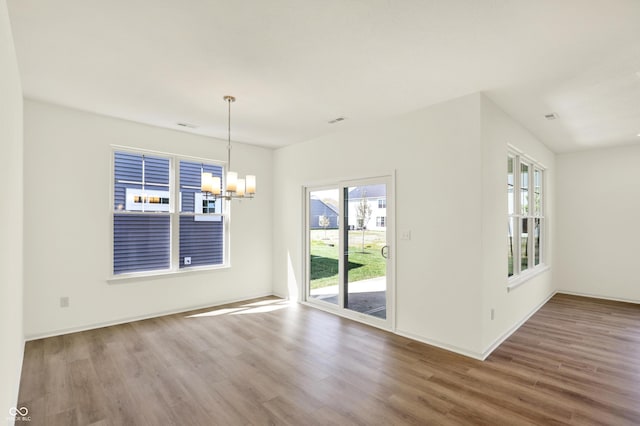 19714 Highclere Ln, Sheridan, IN 46069 - interior space featuring a notable chandelier, a wealth of natural light, and wood finished floors
