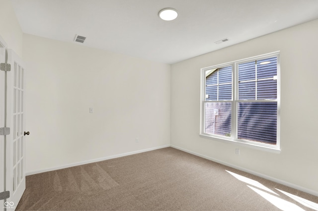 19714 Highclere Ln, Sheridan, IN 46069 - carpeted spare room featuring visible vents, baseboards, and french doors