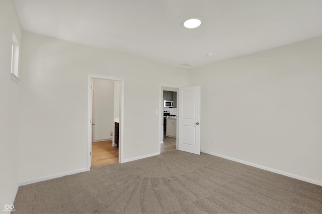 19714 Highclere Ln, Sheridan, IN 46069 - unfurnished bedroom featuring carpet floors, baseboards, and ensuite bathroom