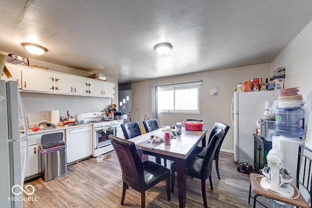 dining area with light wood-type flooring