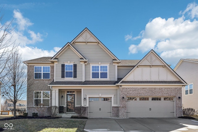 craftsman-style house with driveway, board and batten siding, and brick siding