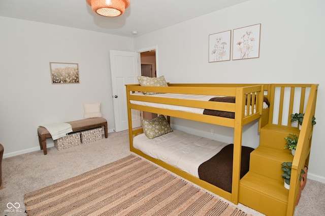 bedroom with carpet and baseboards