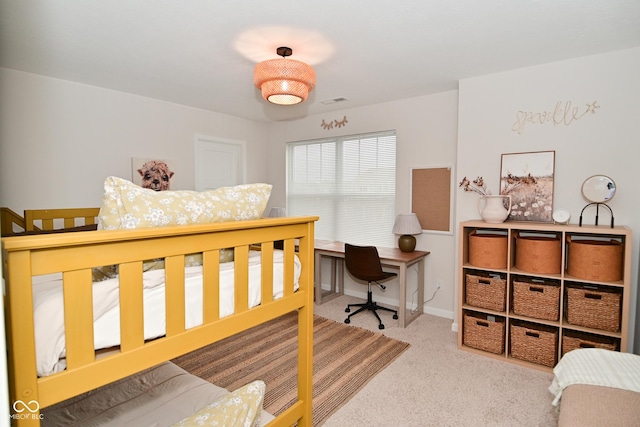 carpeted bedroom with visible vents and baseboards