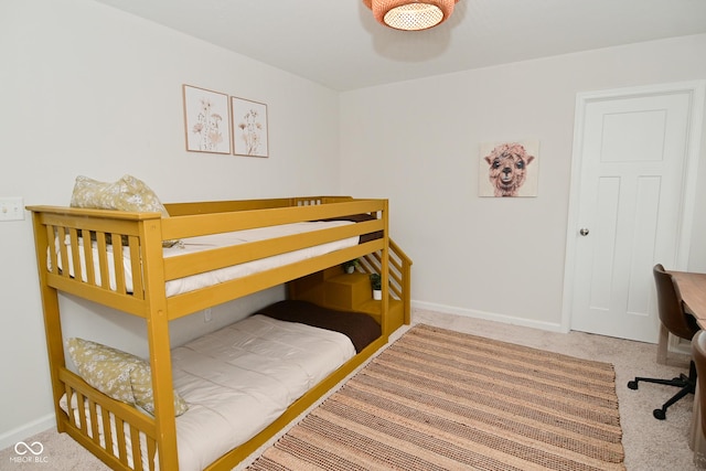 carpeted bedroom with baseboards