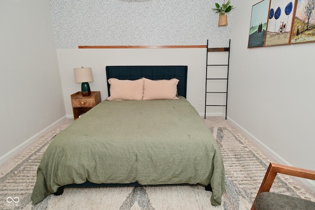 carpeted bedroom featuring baseboards