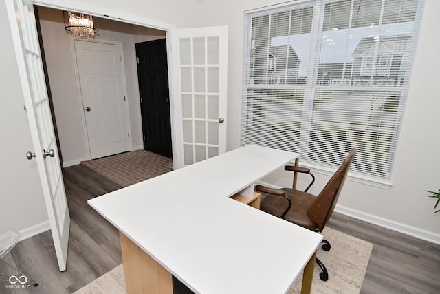 office area featuring dark wood-type flooring and baseboards