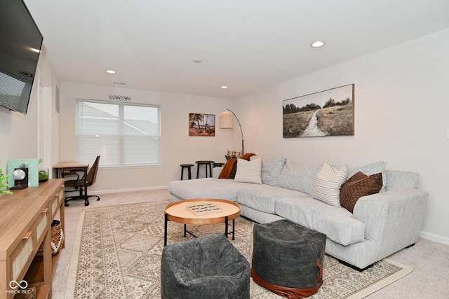 carpeted living room featuring recessed lighting and baseboards