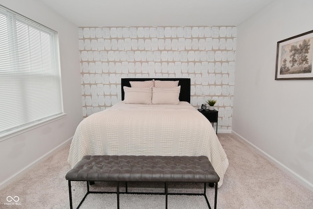 bedroom with baseboards and carpet flooring