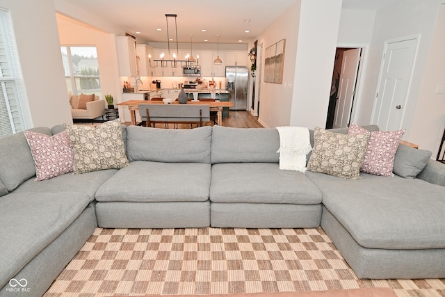 living area with a notable chandelier and recessed lighting