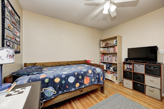 bedroom with ceiling fan and wood finished floors