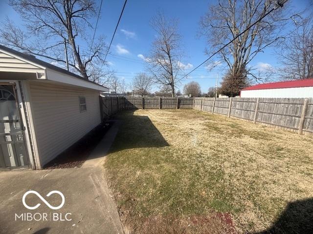 view of yard with a fenced backyard