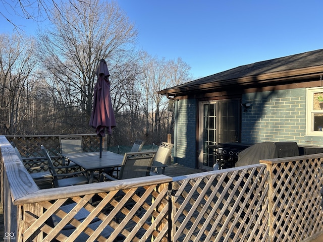 wooden deck with outdoor dining space