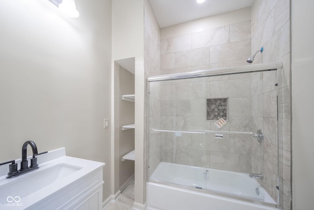 bathroom with shower / bath combination with glass door and vanity