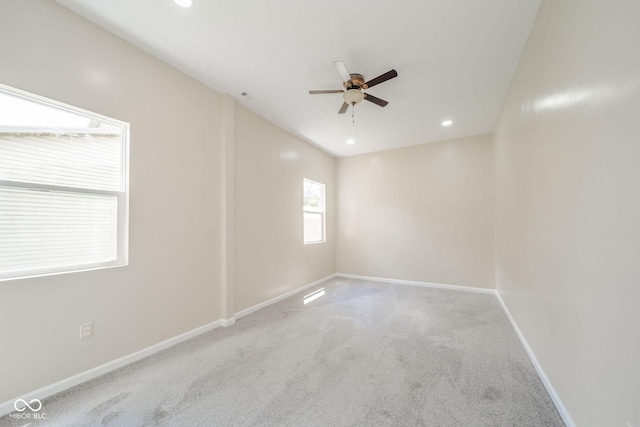 carpeted spare room featuring ceiling fan, recessed lighting, and baseboards