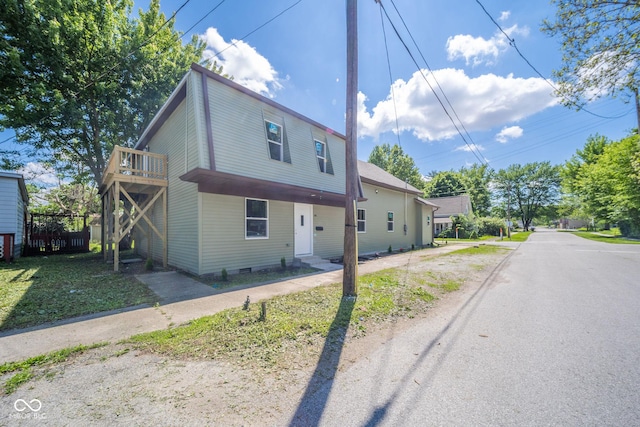 view of side of home featuring crawl space