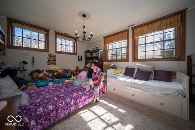 carpeted bedroom featuring visible vents