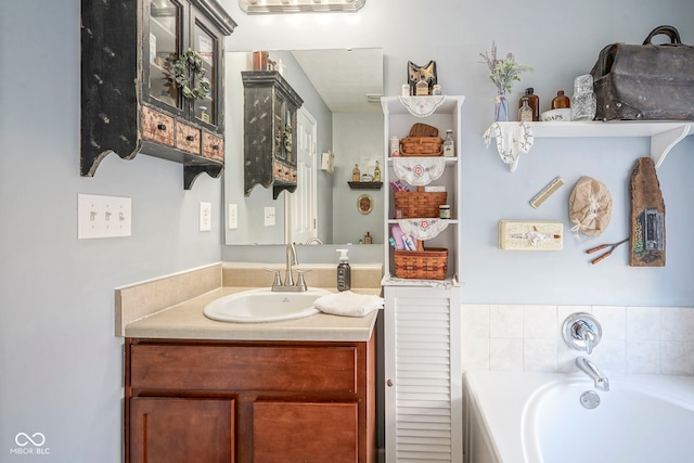 full bathroom featuring a bath and vanity