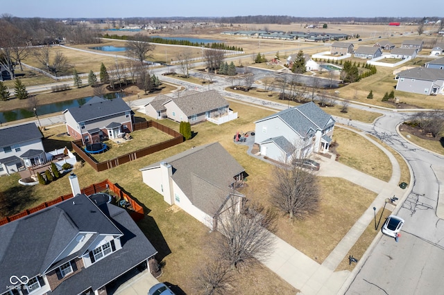 aerial view featuring a water view and a residential view