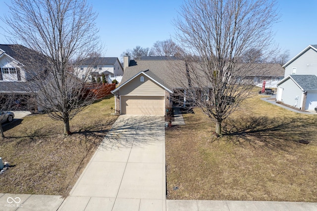 view of front of property featuring a garage, a front yard, a chimney, and driveway