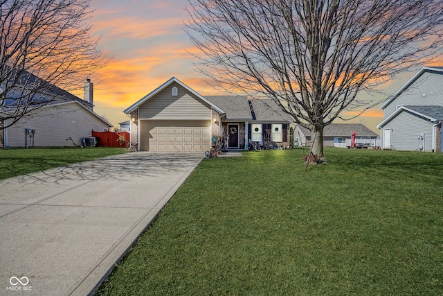 ranch-style house with a front lawn, fence, cooling unit, driveway, and an attached garage