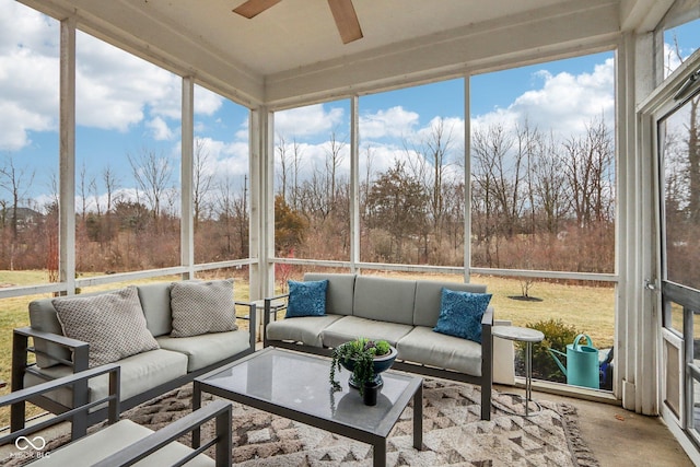 sunroom / solarium featuring ceiling fan