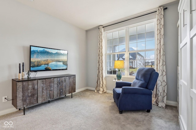 sitting room with carpet floors and baseboards