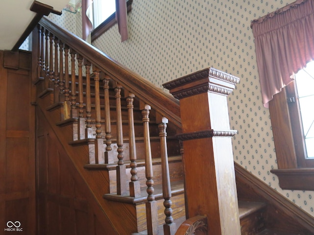 staircase featuring wallpapered walls