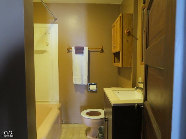 full bath featuring toilet, vanity, and baseboards