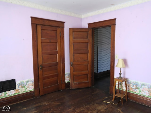 bedroom with dark wood-type flooring and visible vents