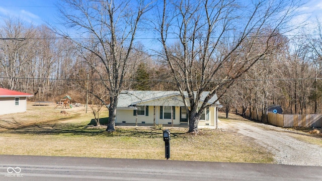 view of front of property with a playground, driveway, crawl space, and a front yard