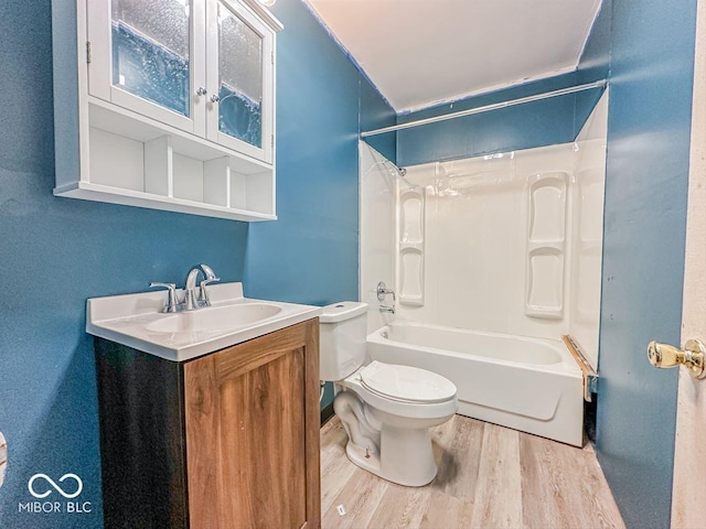 full bathroom with vanity, shower / bathing tub combination, wood finished floors, and toilet