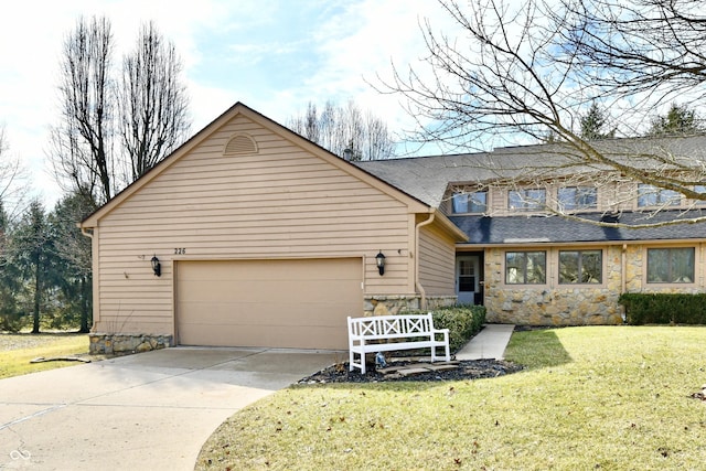 traditional home featuring a front yard, stone siding, driveway, and an attached garage