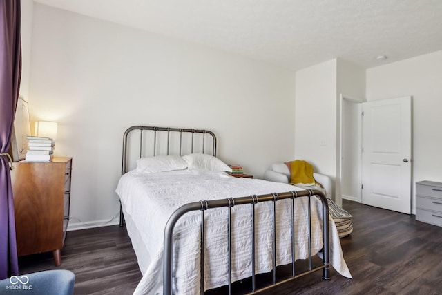 bedroom featuring wood finished floors