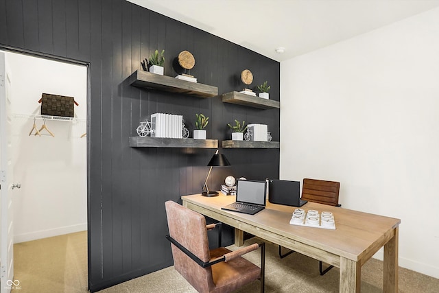 office featuring light carpet and baseboards