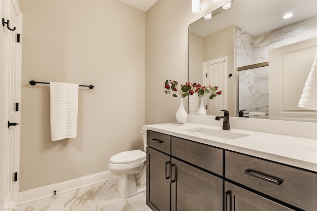 full bath featuring marble finish floor, a marble finish shower, toilet, vanity, and baseboards