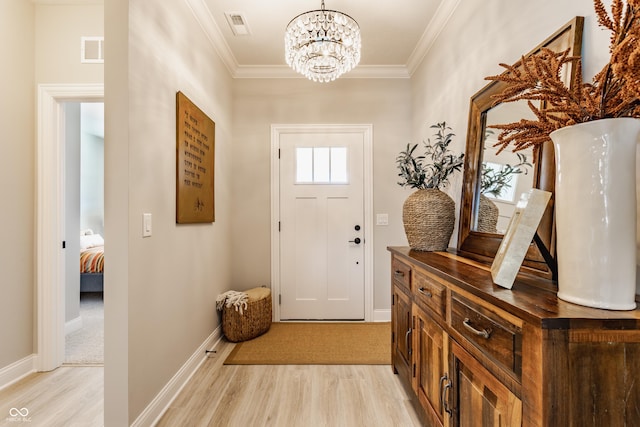 doorway to outside with light wood-style floors, visible vents, and ornamental molding