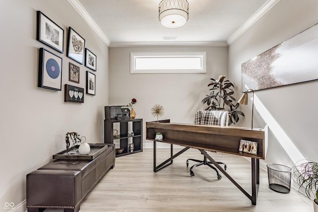 office with light wood-style floors, visible vents, ornamental molding, and baseboards