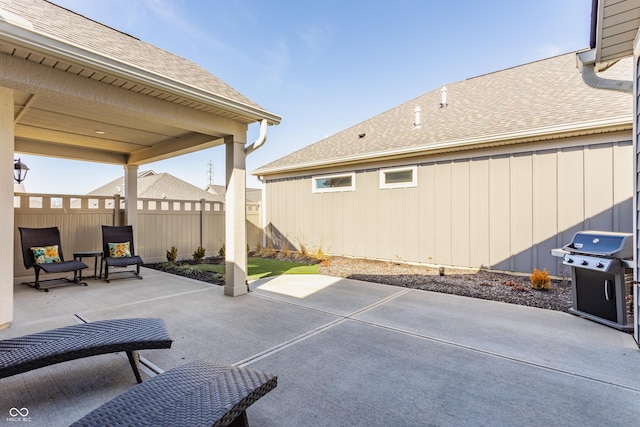 view of patio featuring fence and area for grilling