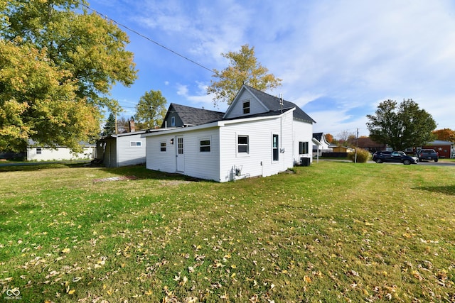 view of home's exterior with a yard