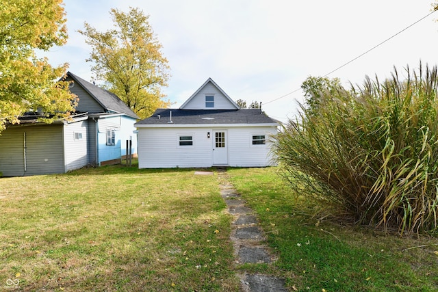 back of house with a yard