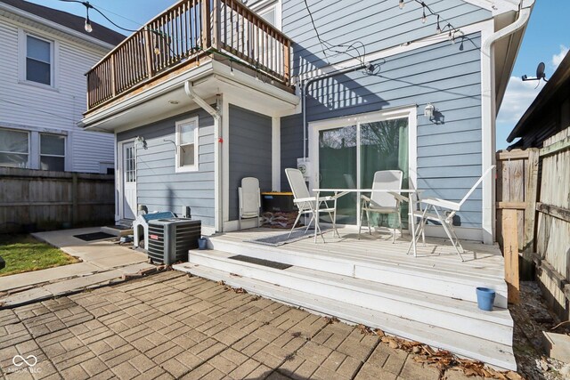 1413 S E St, Indianapolis, IN 46225 - back of property with a balcony, entry steps, and a fenced backyard