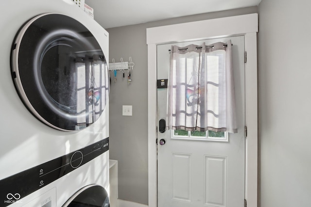 1413 S E St, Indianapolis, IN 46225 - washroom featuring laundry area and stacked washing maching and dryer