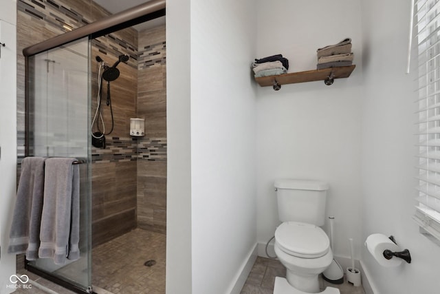 1413 S E St, Indianapolis, IN 46225 - bathroom with baseboards, toilet, and a shower stall