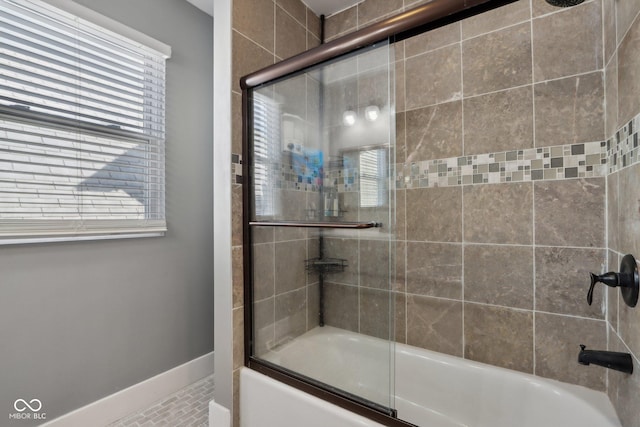 1413 S E St, Indianapolis, IN 46225 - bathroom featuring baseboards and bath / shower combo with glass door